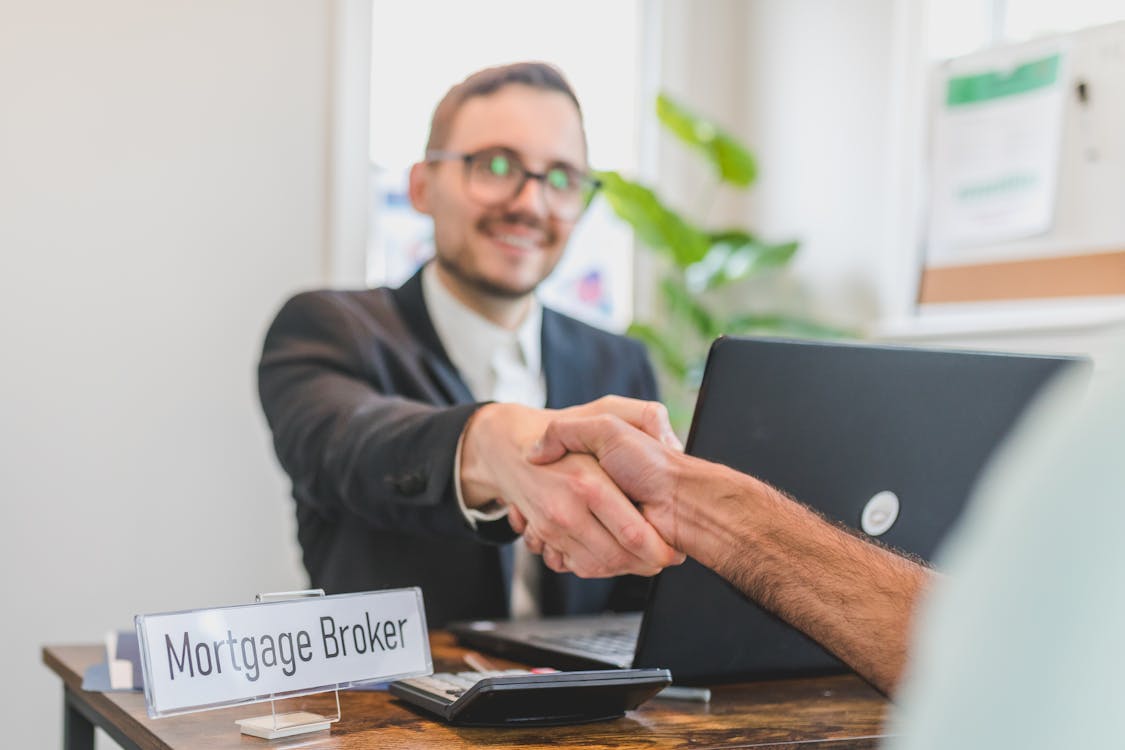 Business handshake sealing a deal — getting the best value at a pawn shop